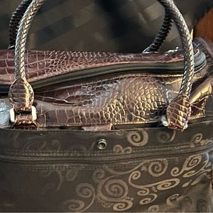 Brighton cosmetic bag! Black with brown trim.  Handles and shoulder strap.